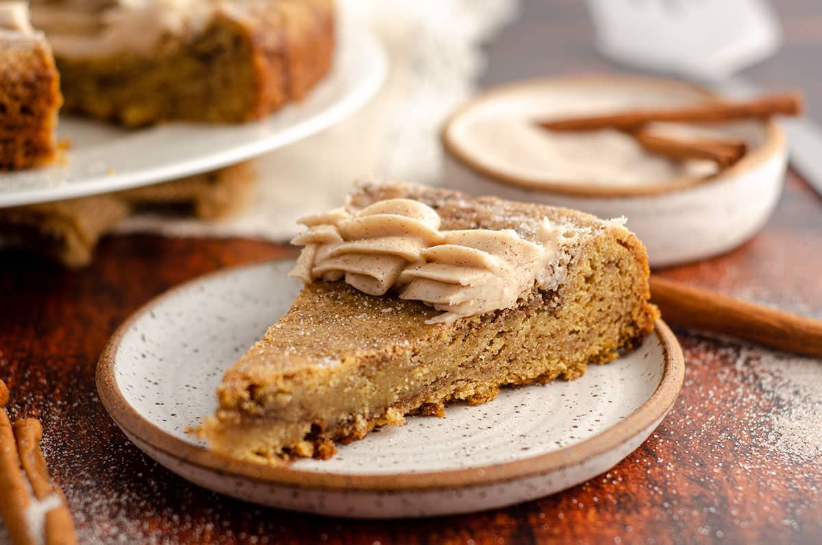 snickerdoodle cookie cake sitting on a ceramic plate