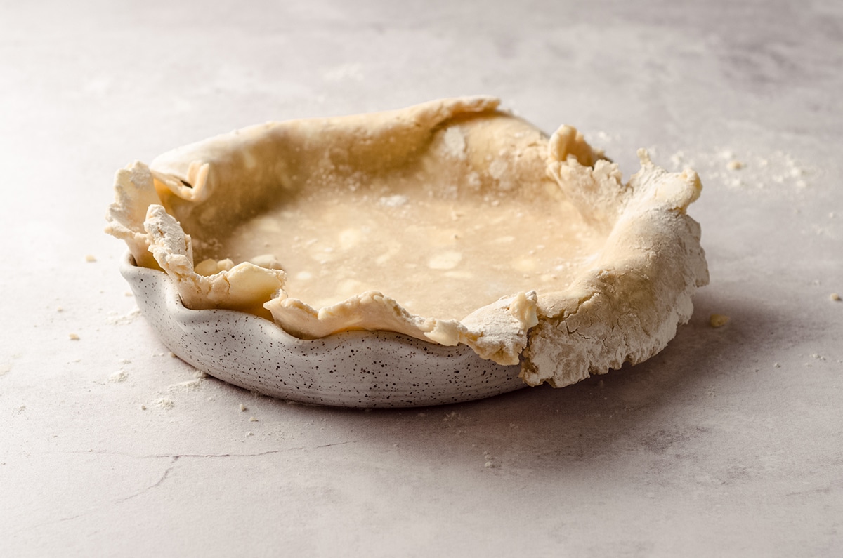 pie crust draped over a pie plate