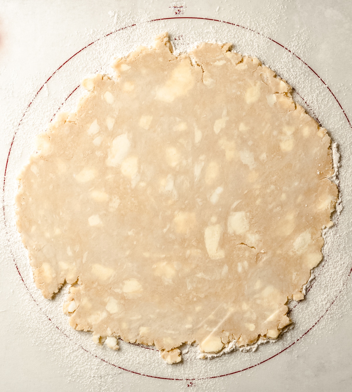 pie crust rolled out on a pastry mat