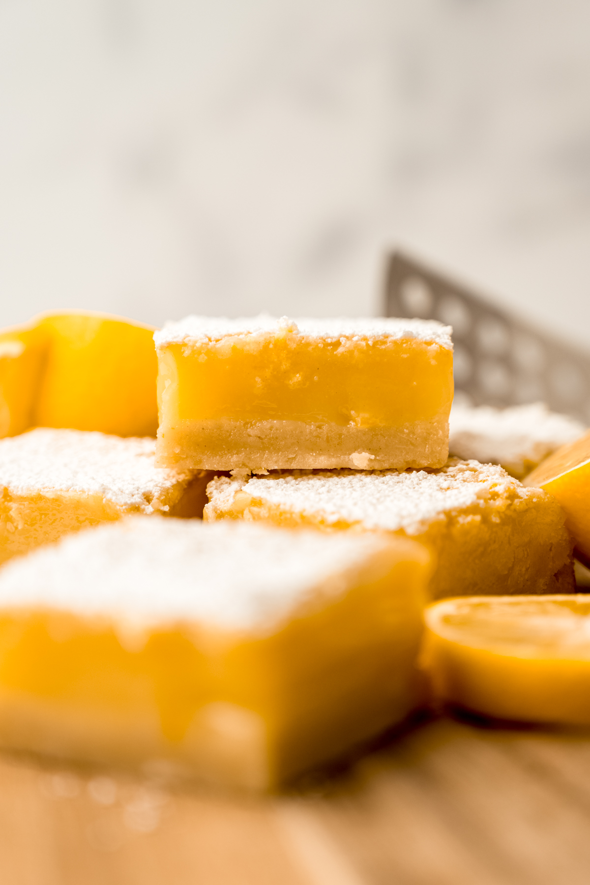 Meyer lemon bars on surface.