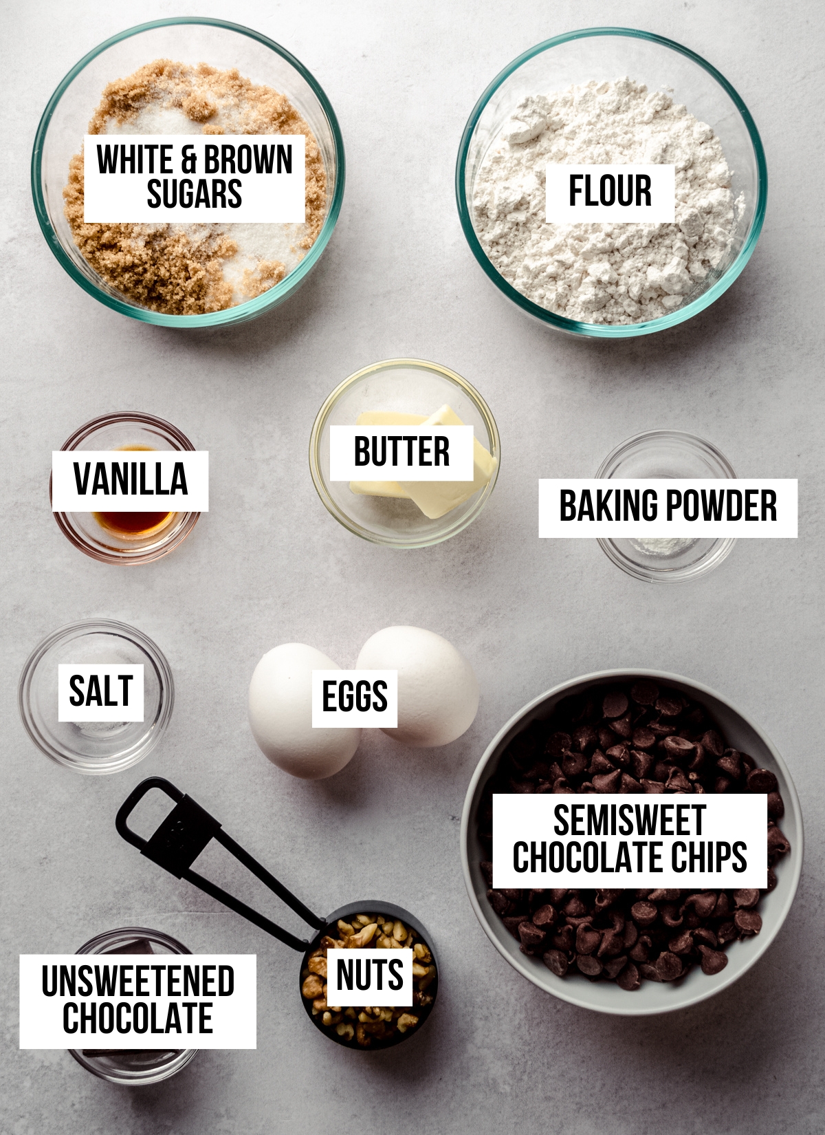 Aerial photo of ingredients to make brownie cookies with text overlay labeling each ingredient. 