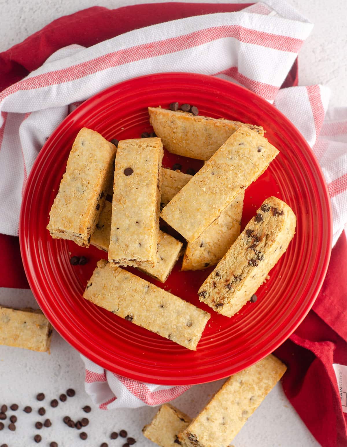 aerial photo of chocolate chip biscotti on a red plate
