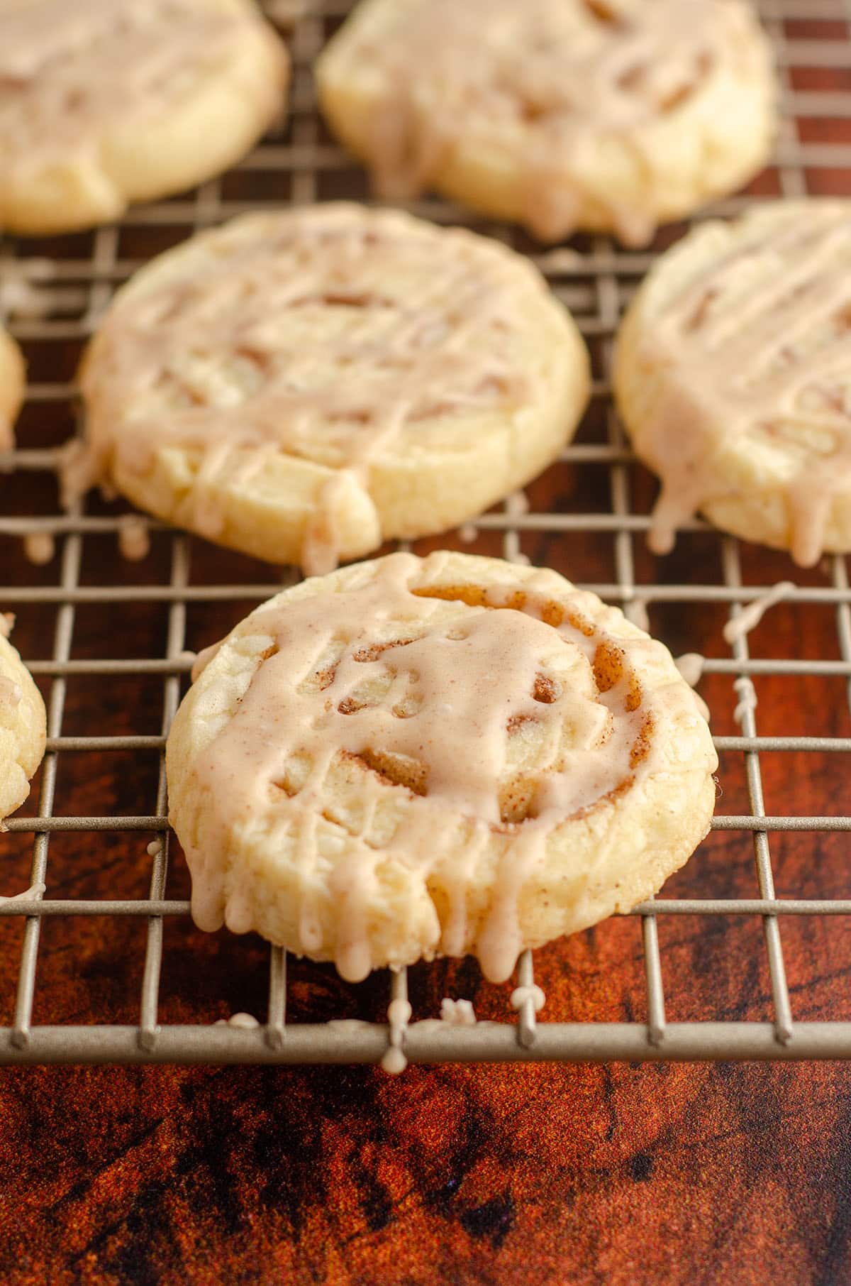 cinnamon pinwheel cookies on a wire cooling rack