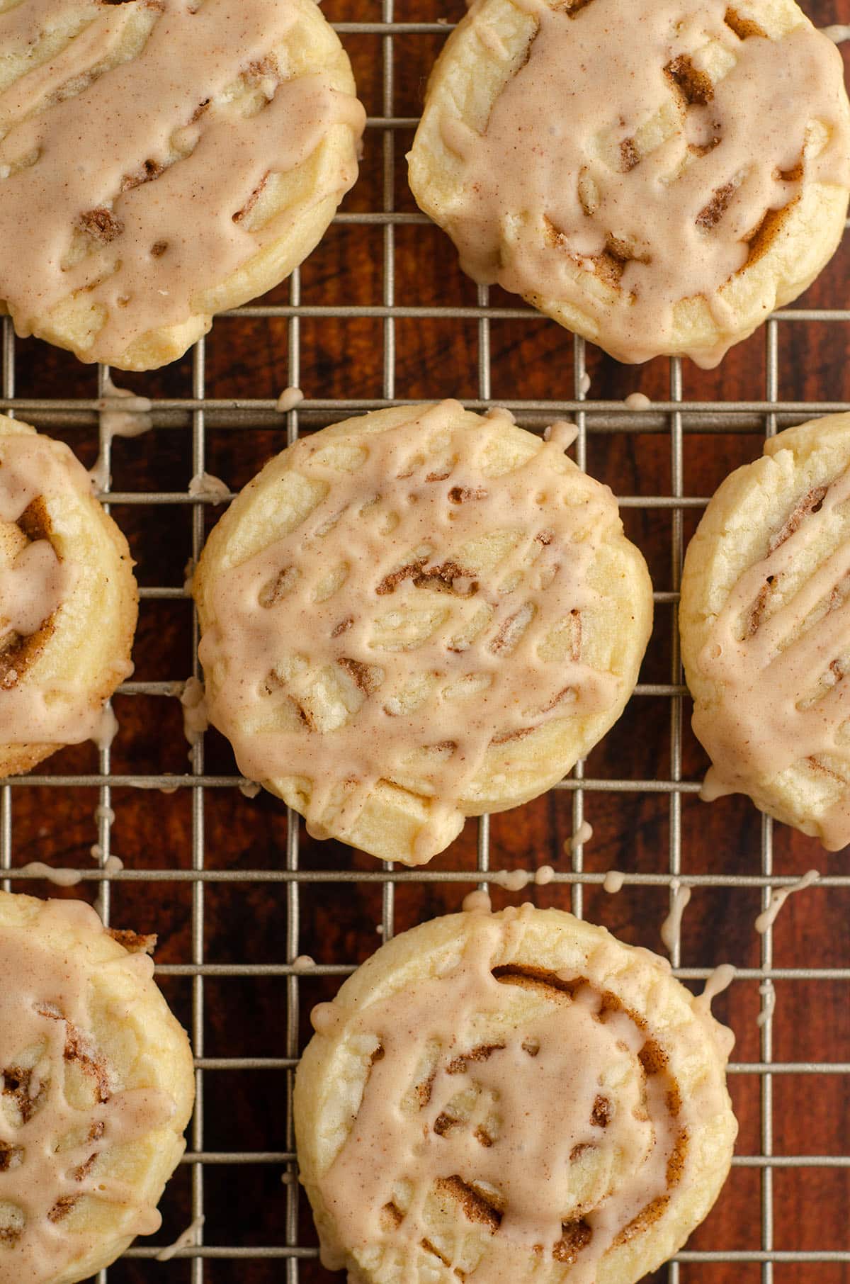 aerial photo of cinnamon pinwheel cookies on a wire cooling rack