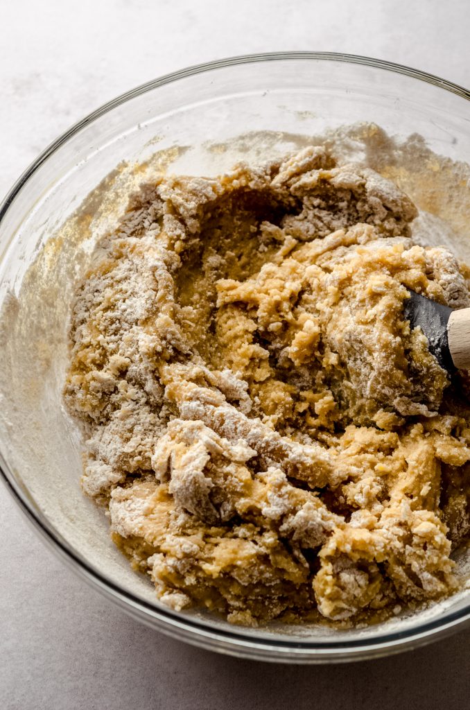 A bowl of chocolate chip cookie dough before adding the chocolate chips.