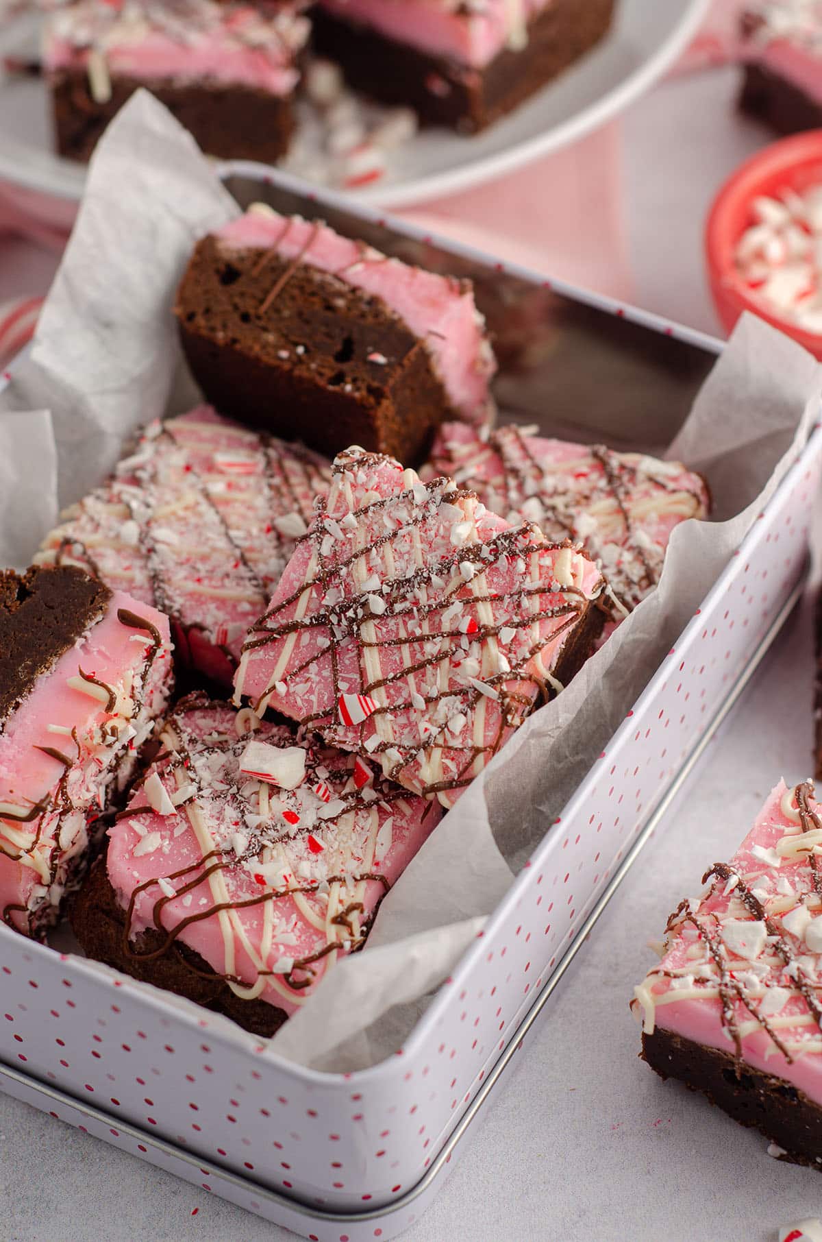 peppermint brownies sitting in a treat box ready to gift