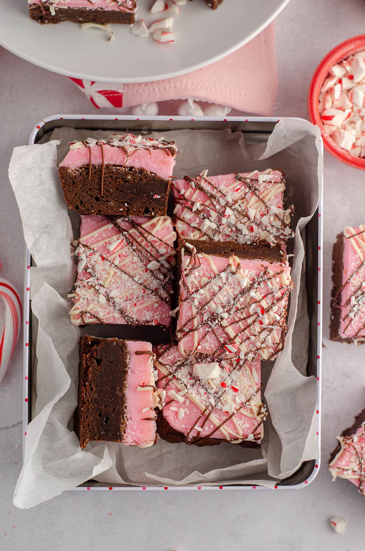 aerial photo of peppermint brownies sitting in a treat box ready to gift