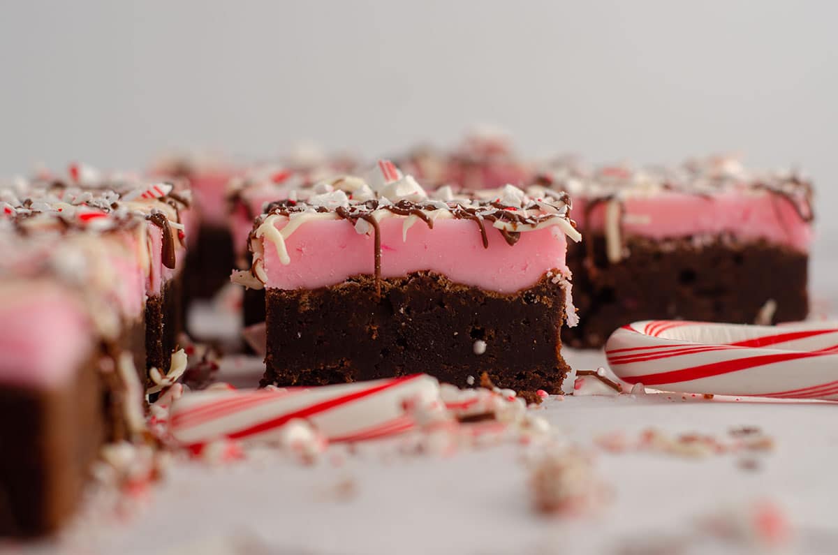 peppermint brownie with crushed candy canes scattered around it