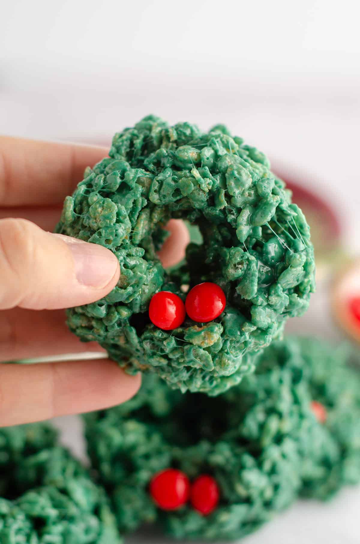 hand holding a rice krispies wreath