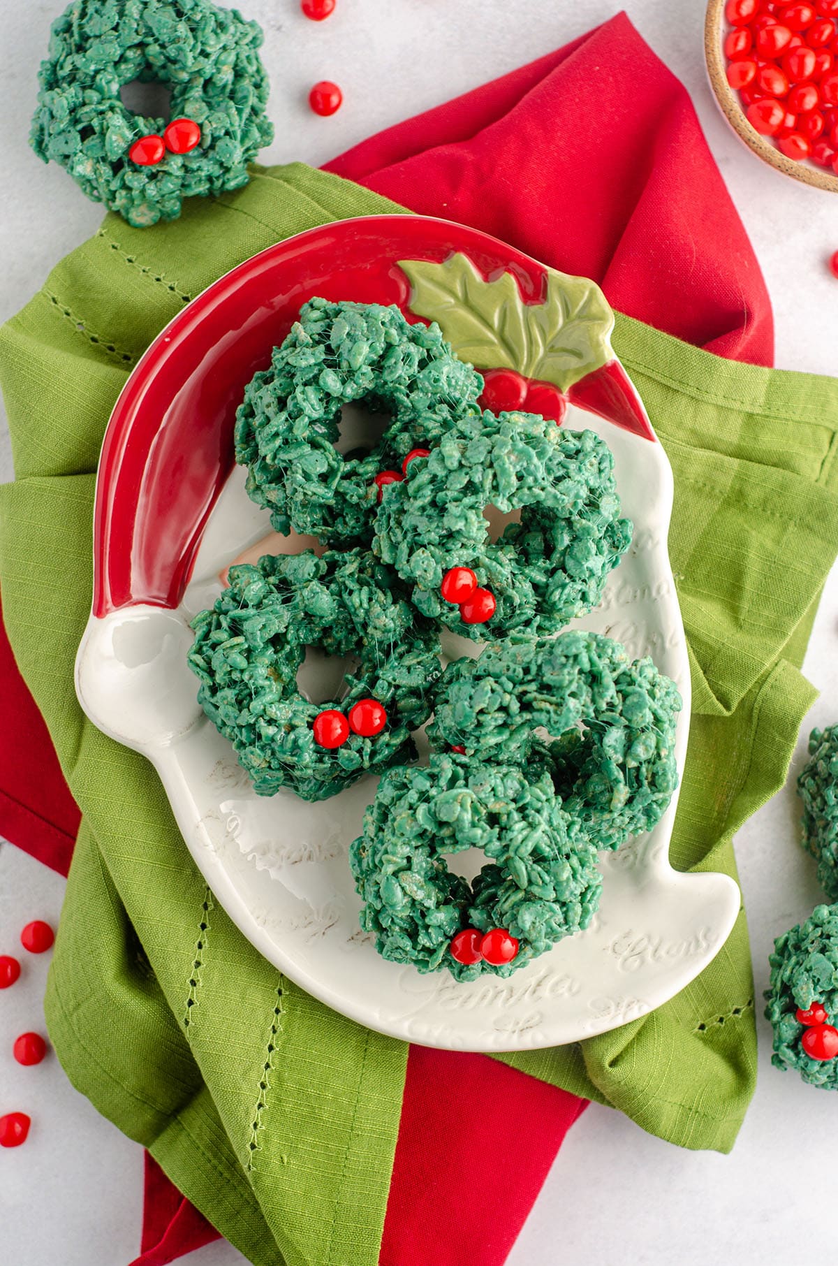 aerial photo of rice krispies wreaths sitting on a santa plate