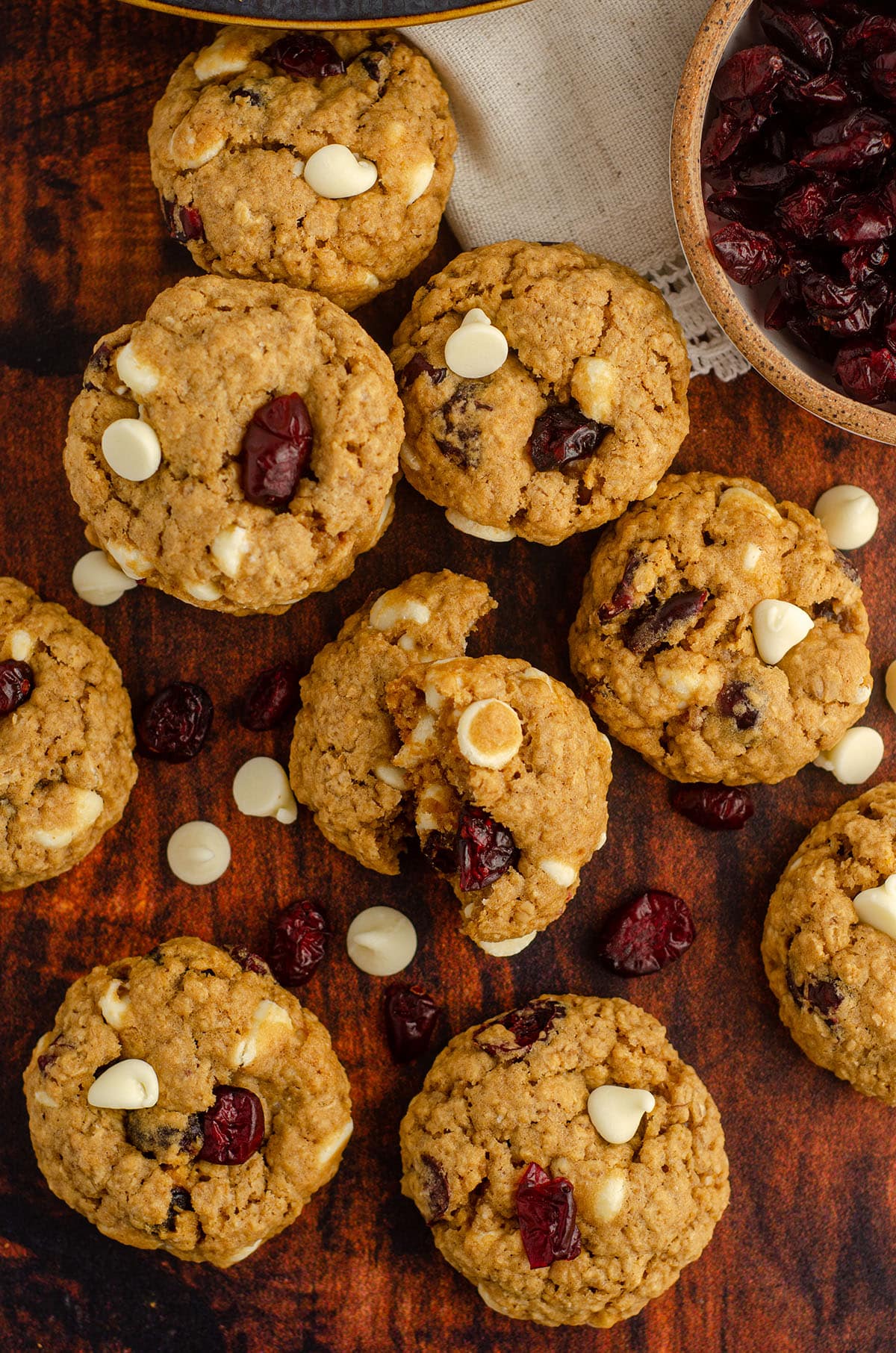 aerial photo of white chocolate cranberry oatmeal cookie broken apart to see the inside