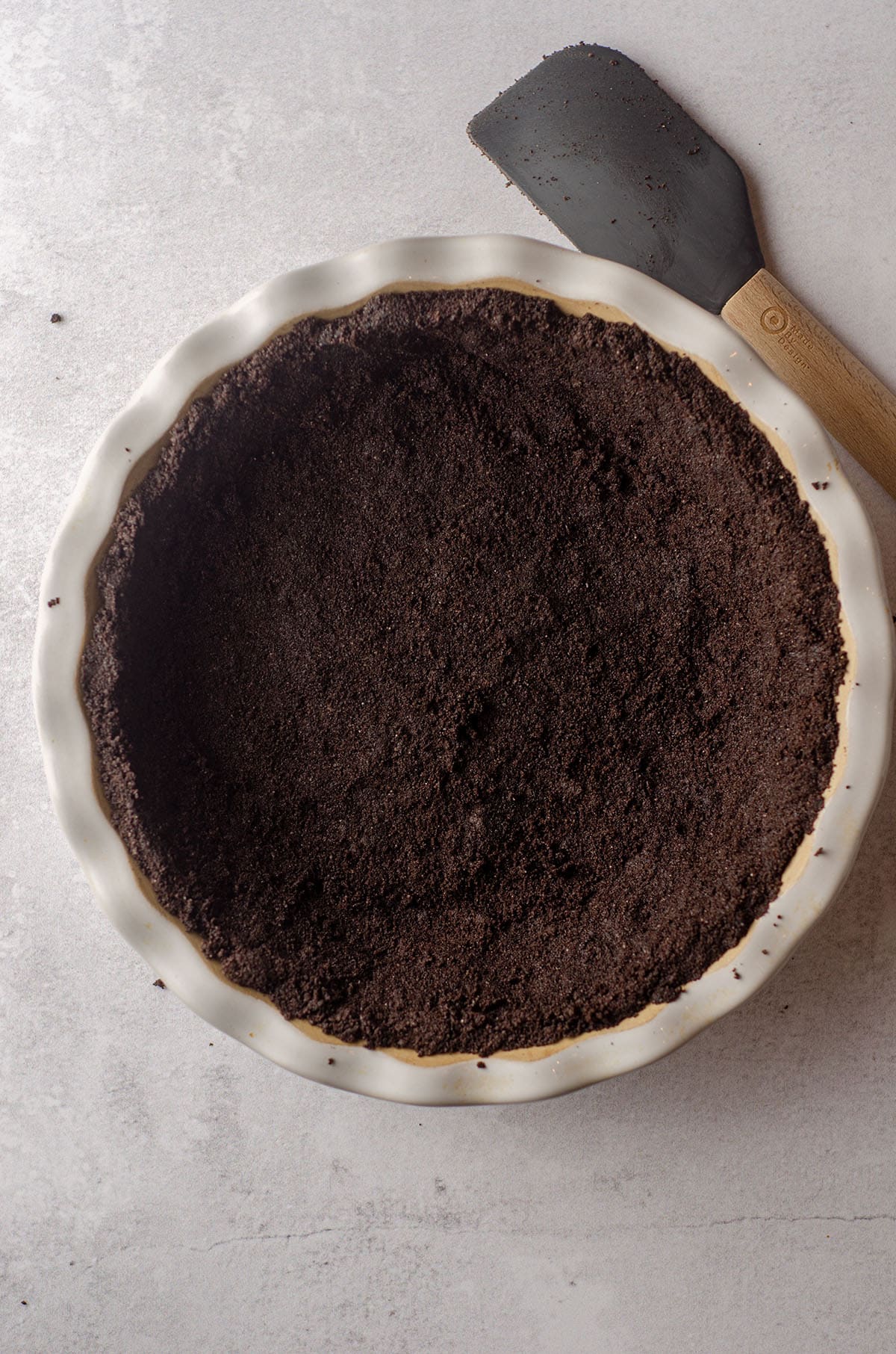 aerial photo of oreo pie crust in a pie plate
