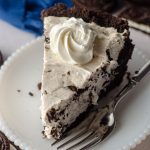 slice of no bake oreo pie sitting on a plate with a fork