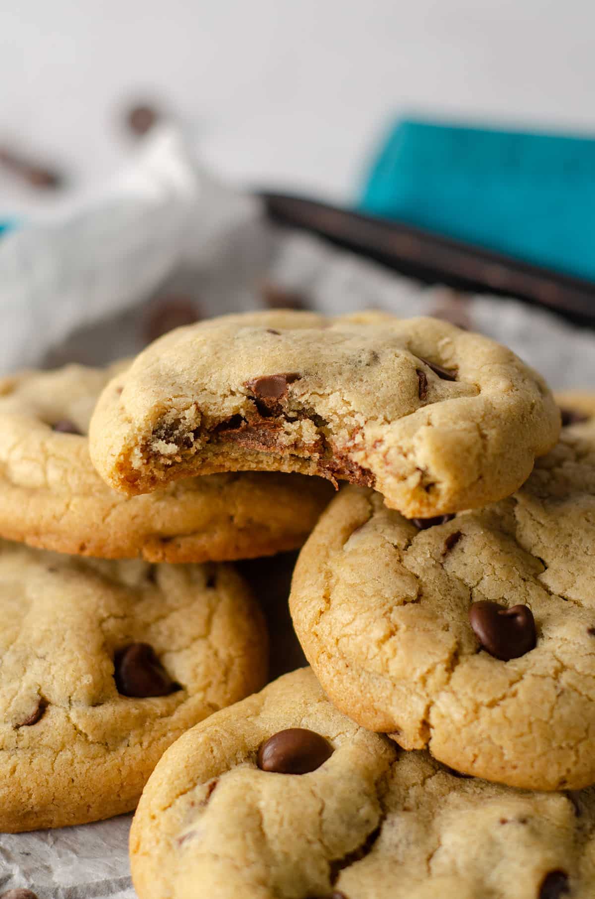 bite taken out of a thick and chewy chocolate chip cookie made in a small batch of 6 cookies