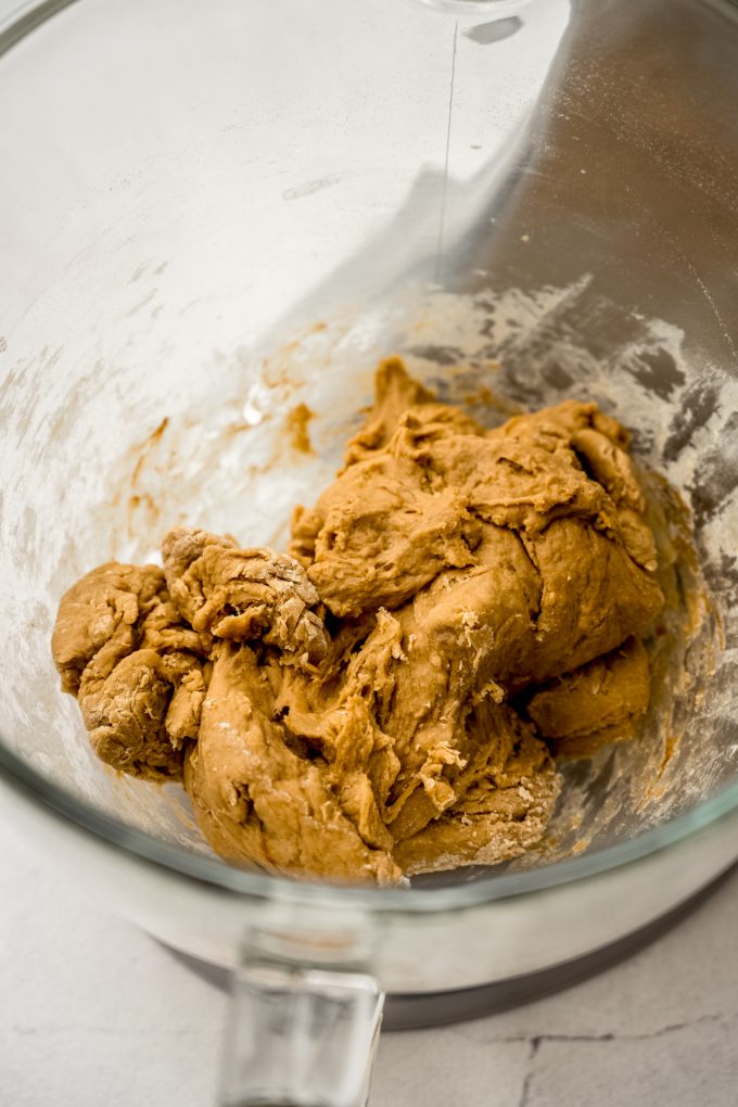 Dough for coffee cinnamon rolls in the bowl of a stand mixer.