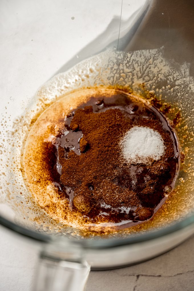Ingredients to make coffee cinnamon rolls in the bowl of a stand mixer.