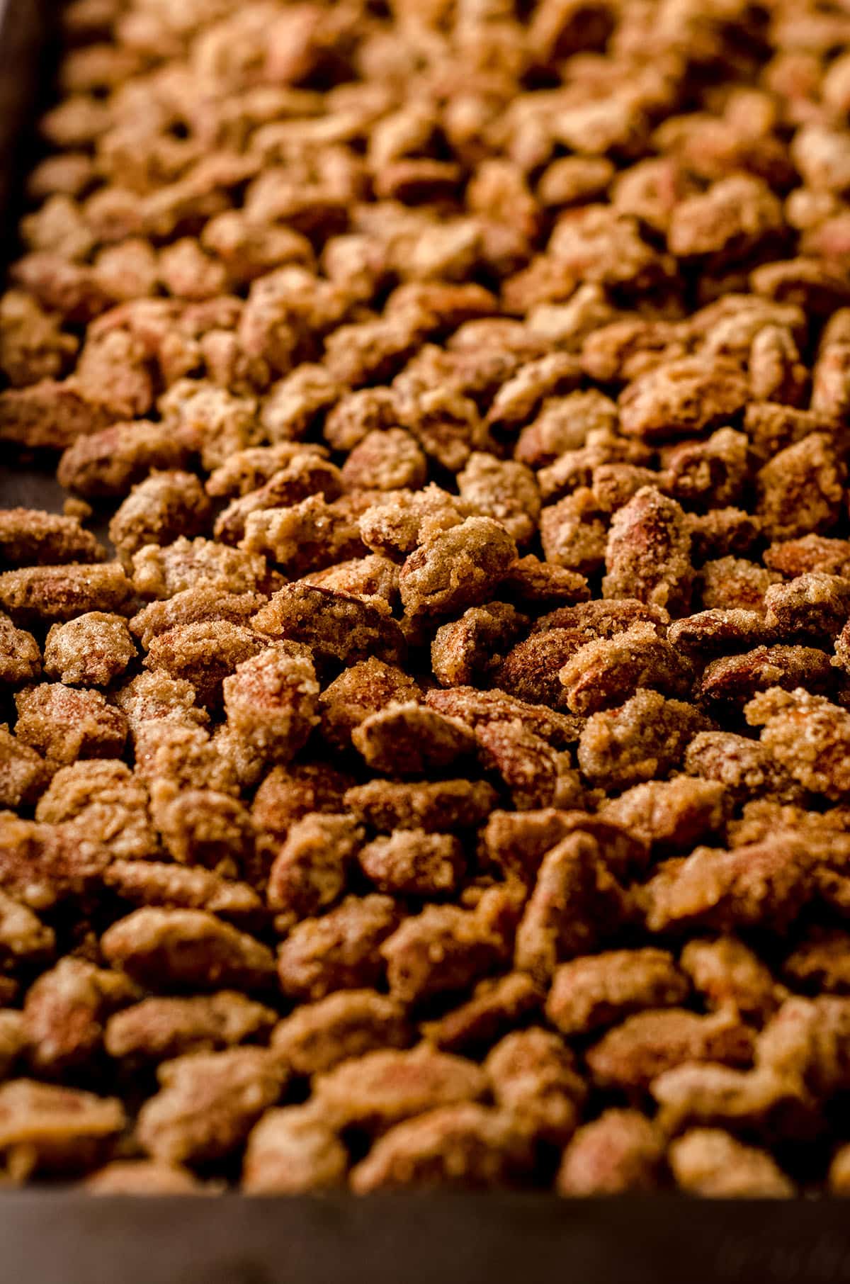 candied almonds on a baking sheet after baking and ready to eat