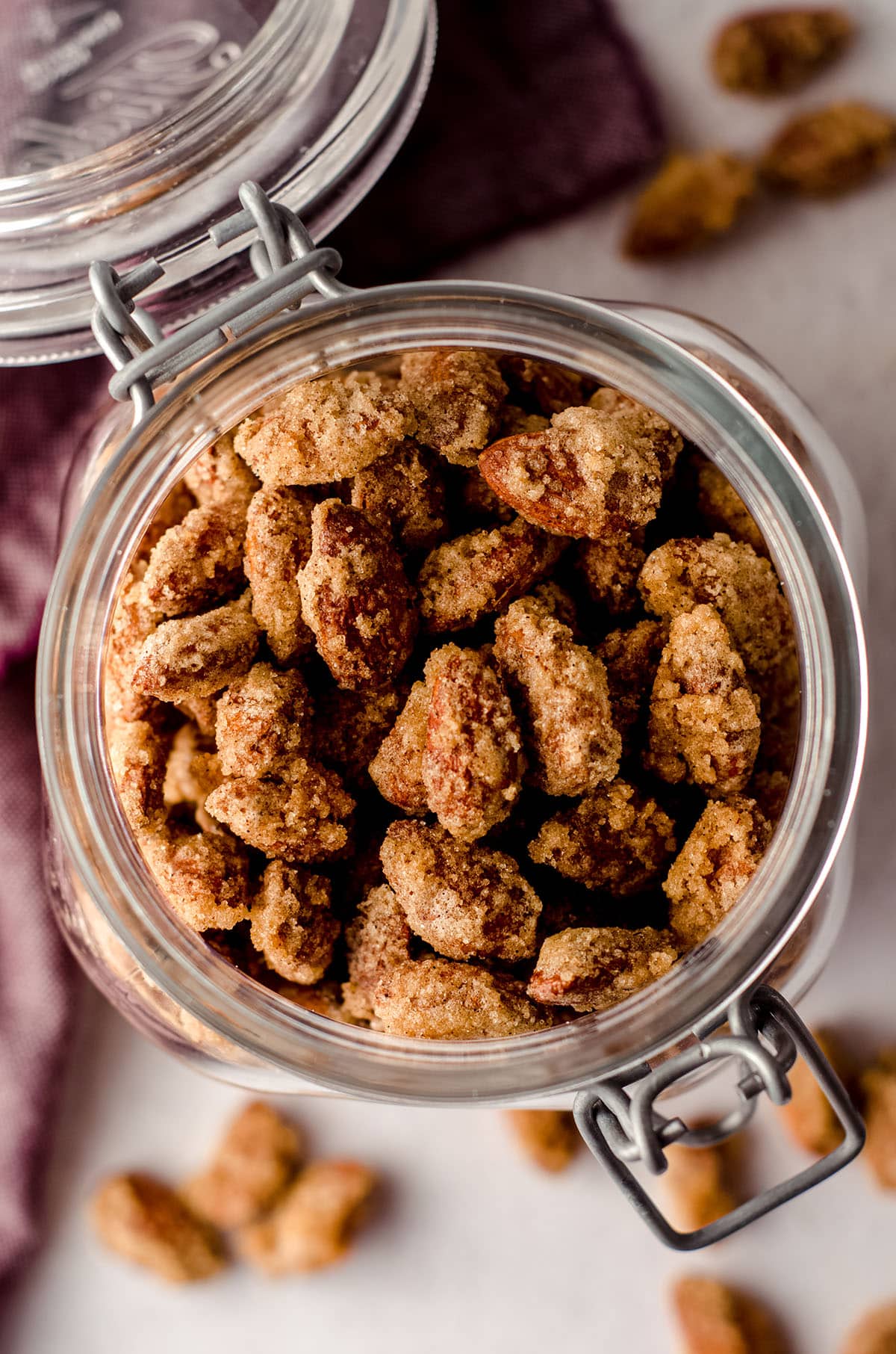 aerial photo of a jar of candied almonds with the lid open