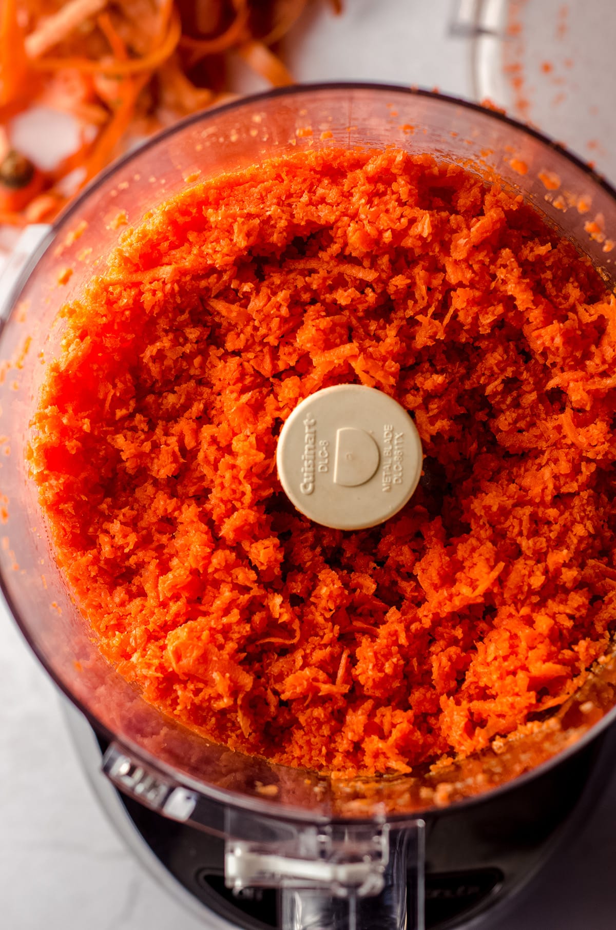 shredded carrots in a food processor