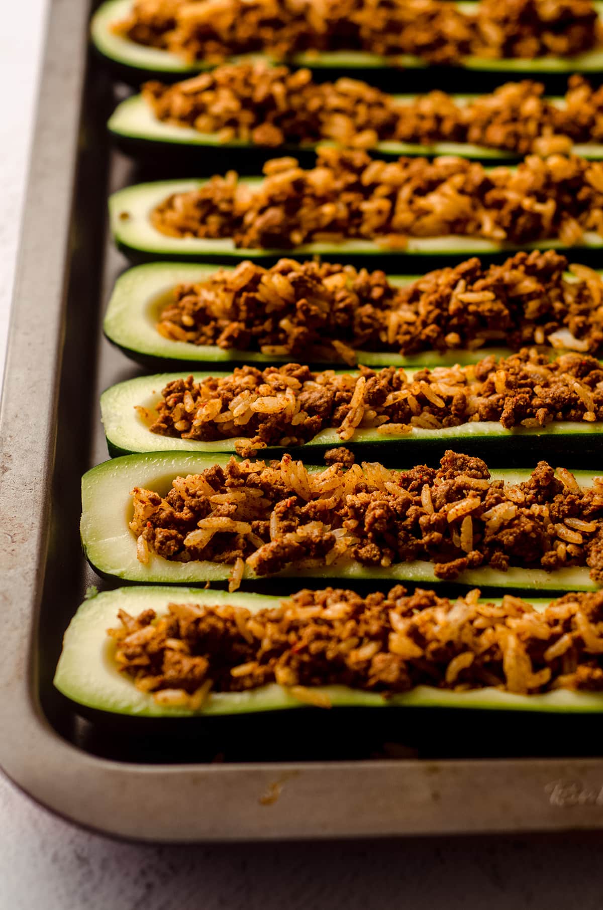 taco zucchini boats filled with meat and rice