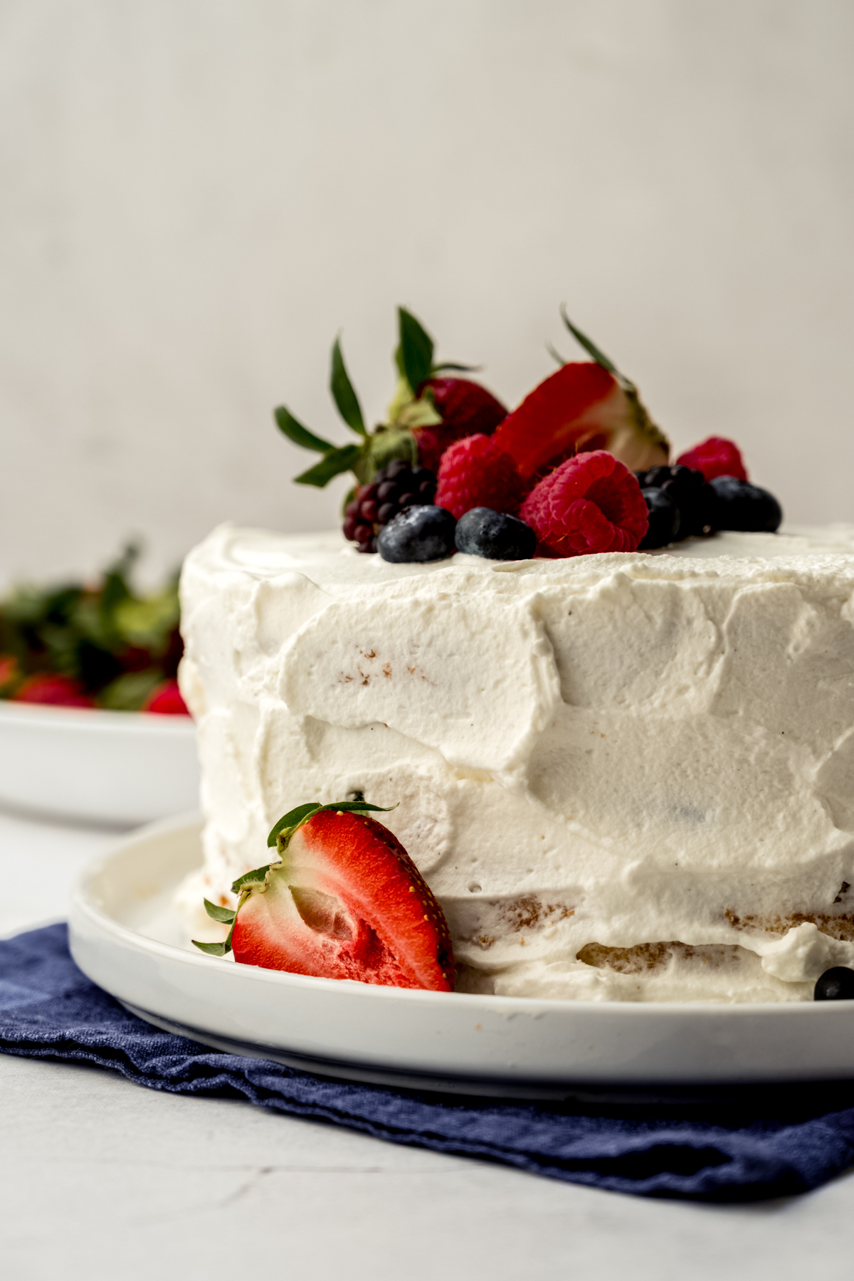 A fresh berry cake on a plate.