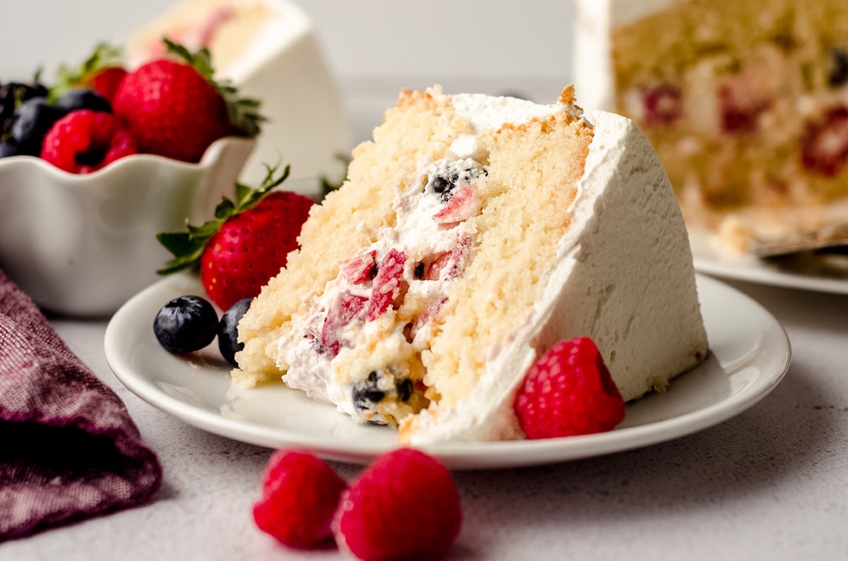 slice of berry cake on a white plate