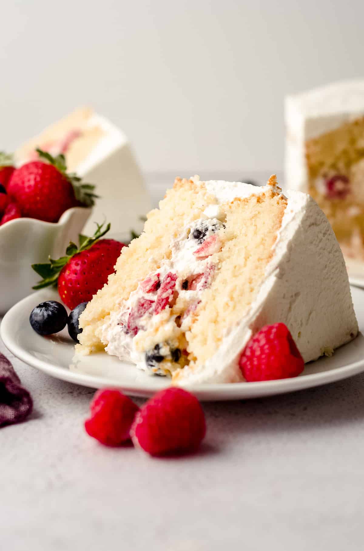 slice of berry cake on a white plate