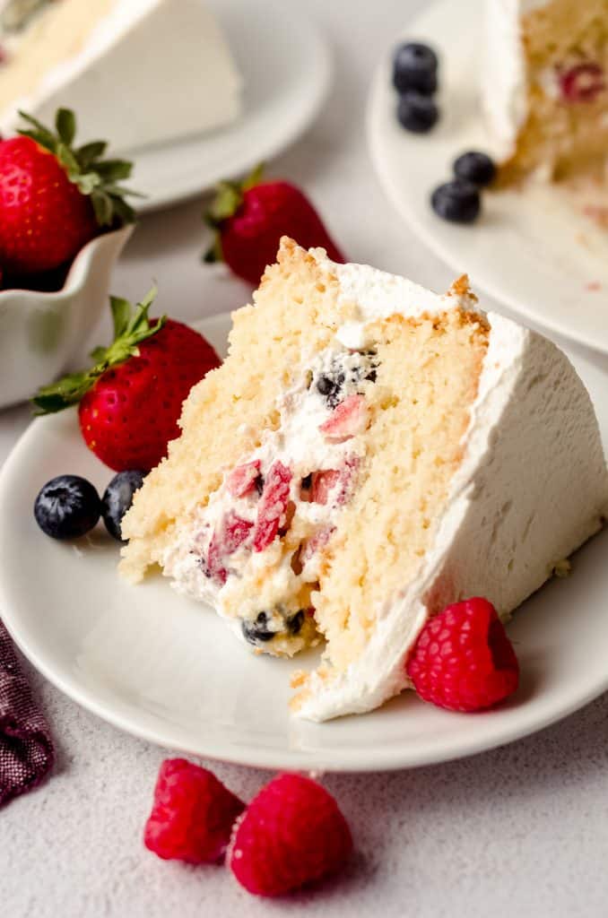 slice of berry cake on a white plate