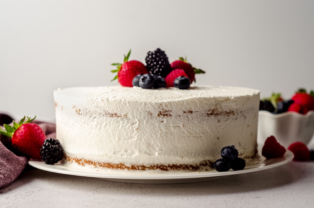 berry cake with fresh berries on top