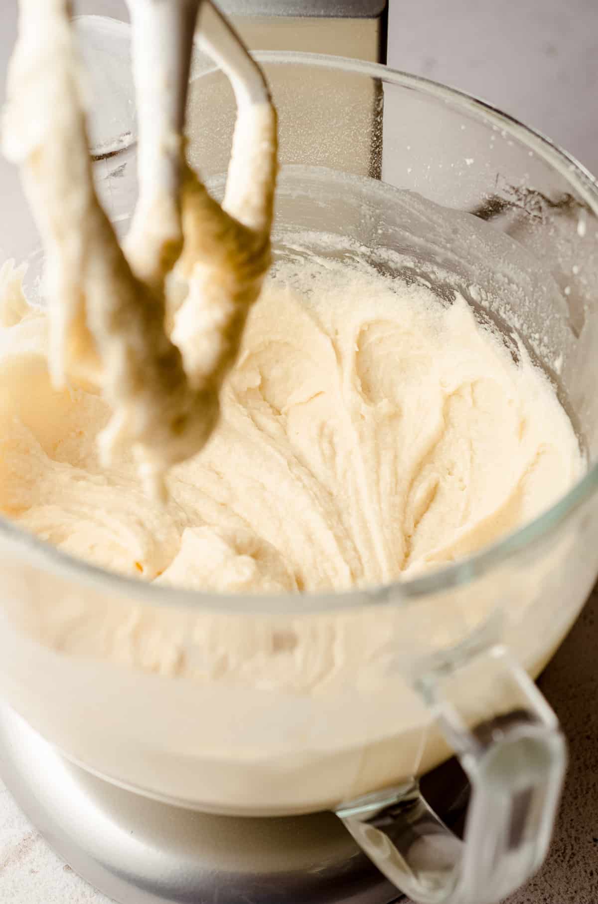 white sheet cake batter in a mixer