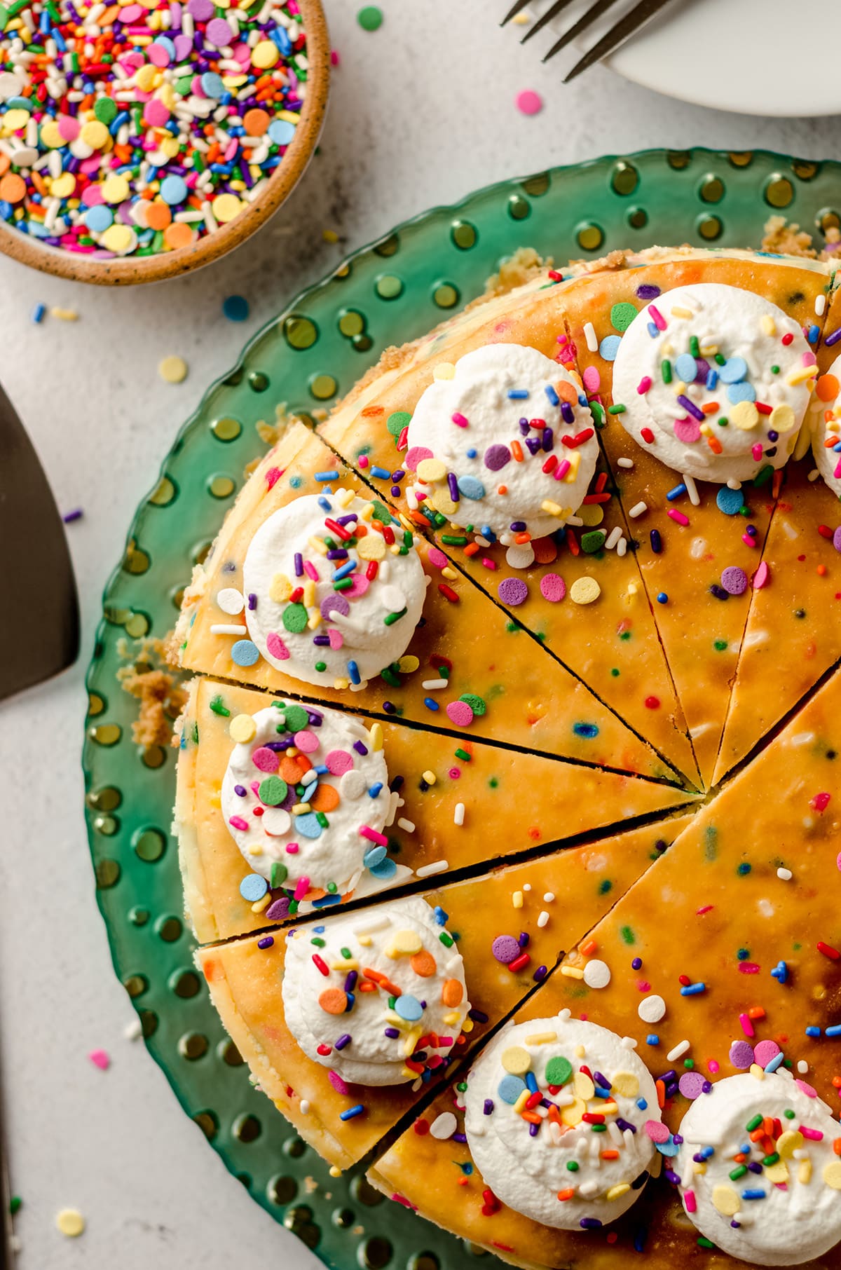 aerial photo of sliced funfetti cheesecake