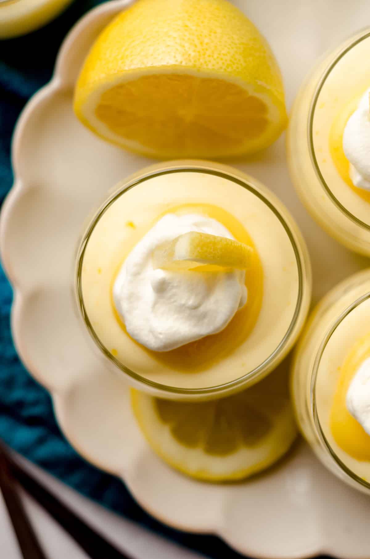 aerial photo of lemon mousse in a cup on a plate