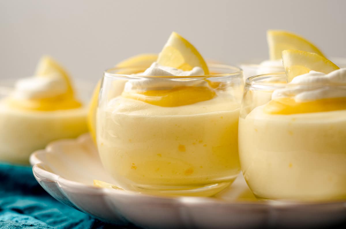 lemon mousse in cups on a plate