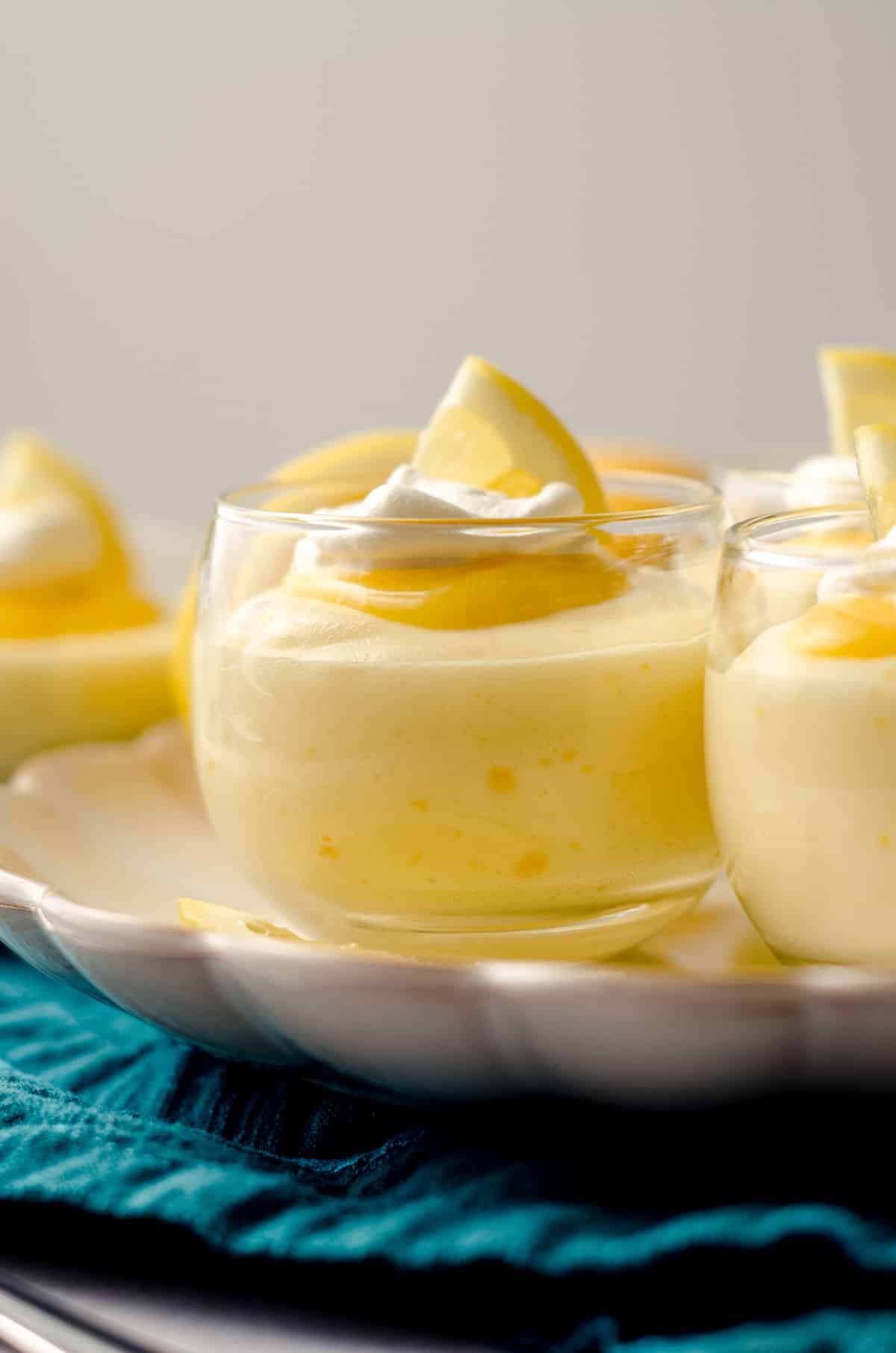 lemon mousse in cups on a plate