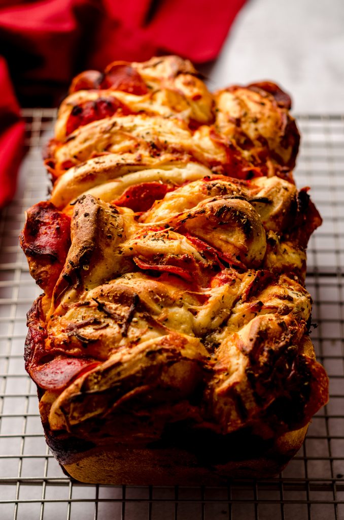 pizza pull apart bread on a cooling rack