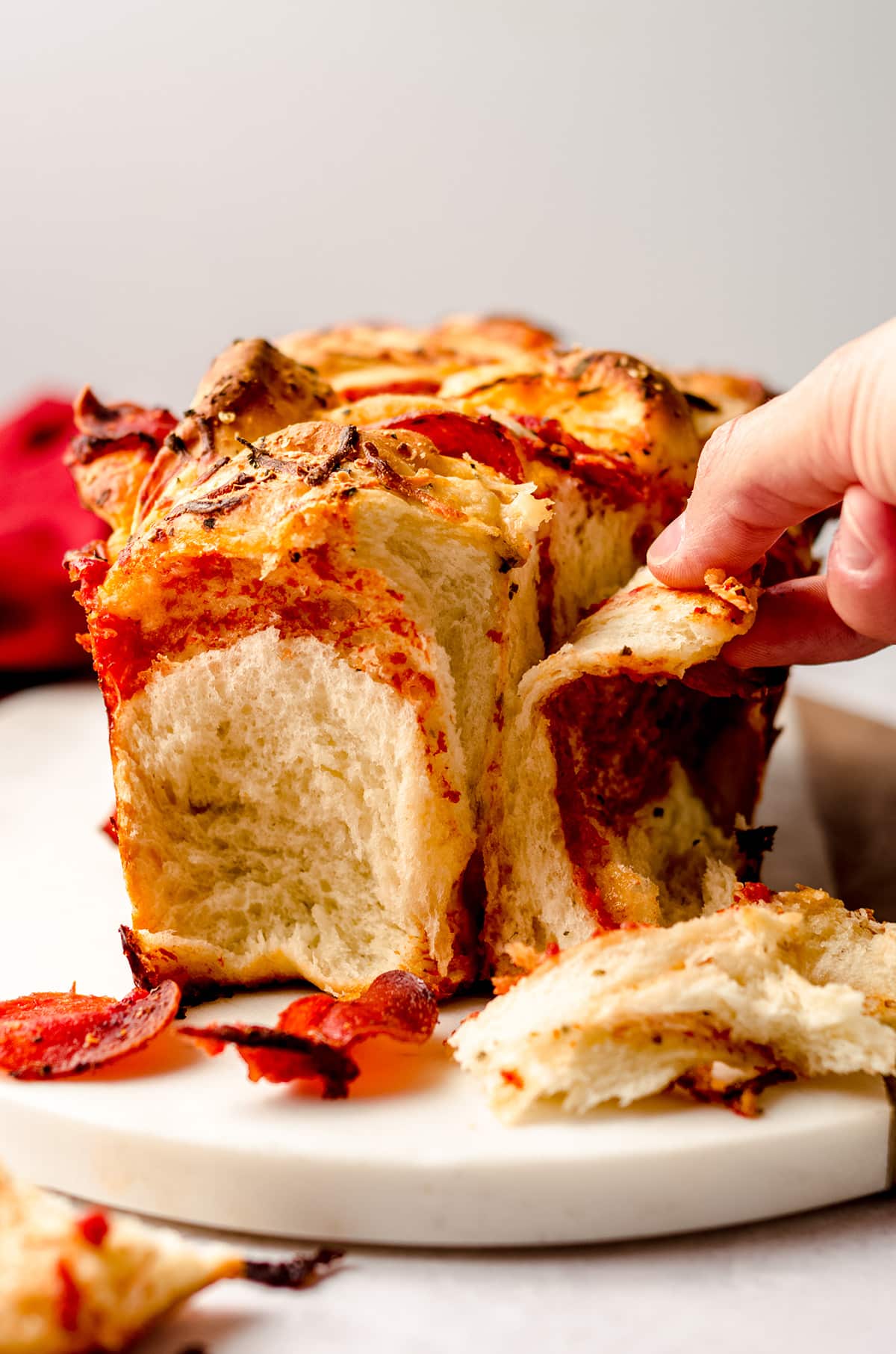 hand pulling apart pizza pull apart bread