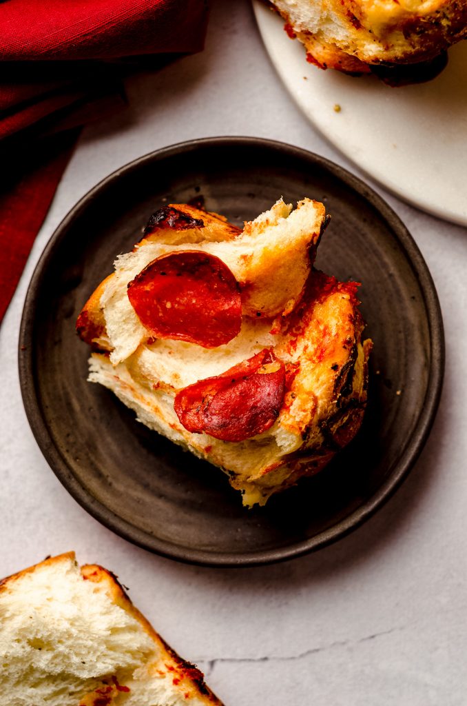 slice of pizza pull apart bread on a plate