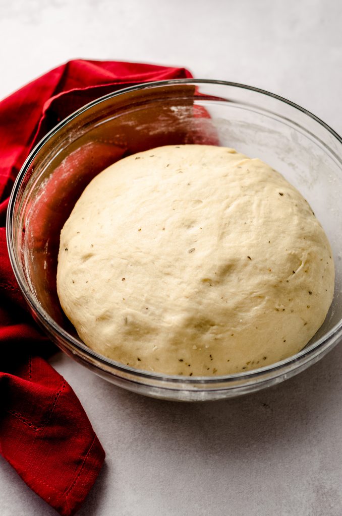 pizza pull apart bread dough in a glass bowl