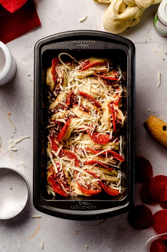 aerial photo of pizza pull apart bread in a loaf pan ready to bake