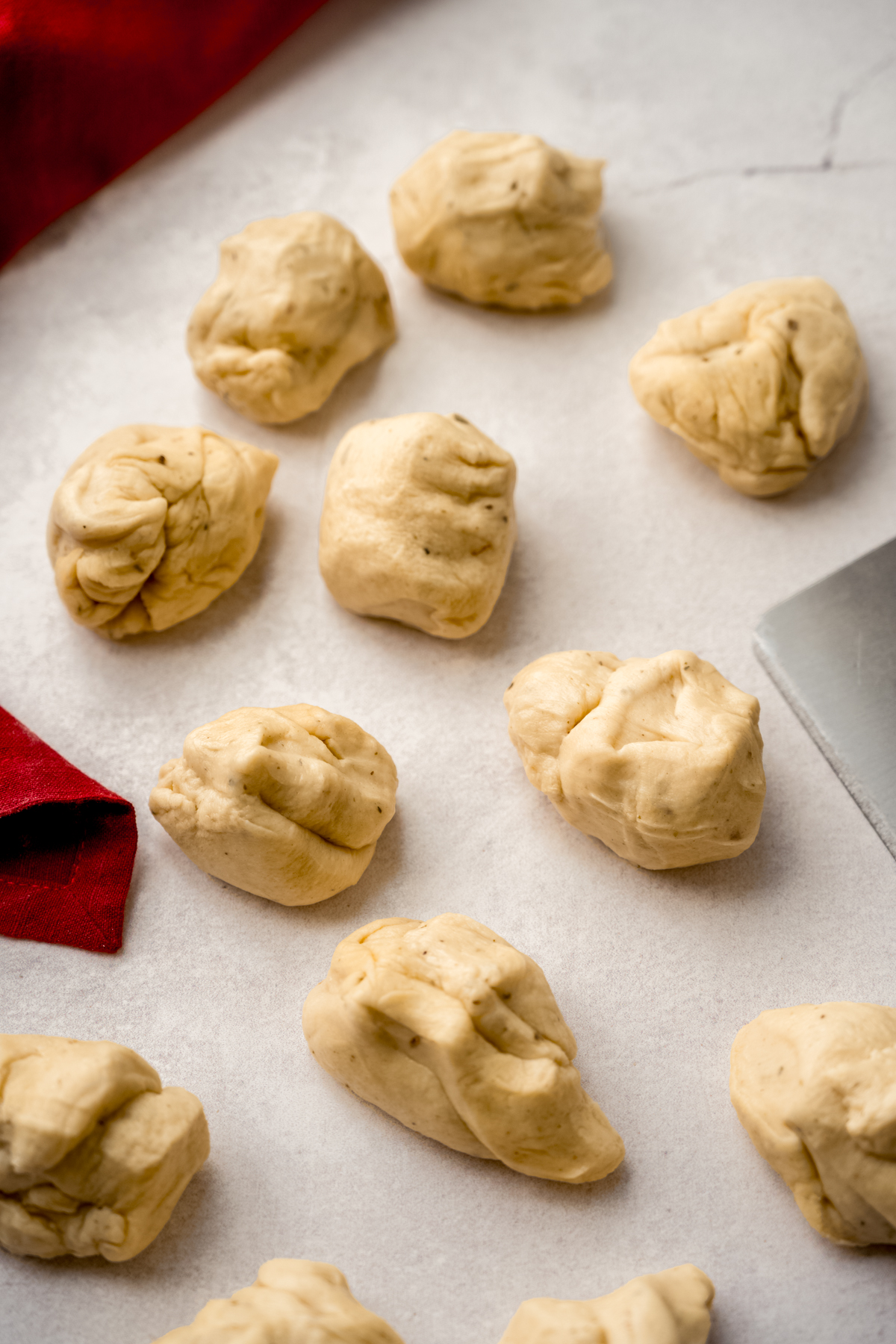 Yeasted dough portioned into pieces.