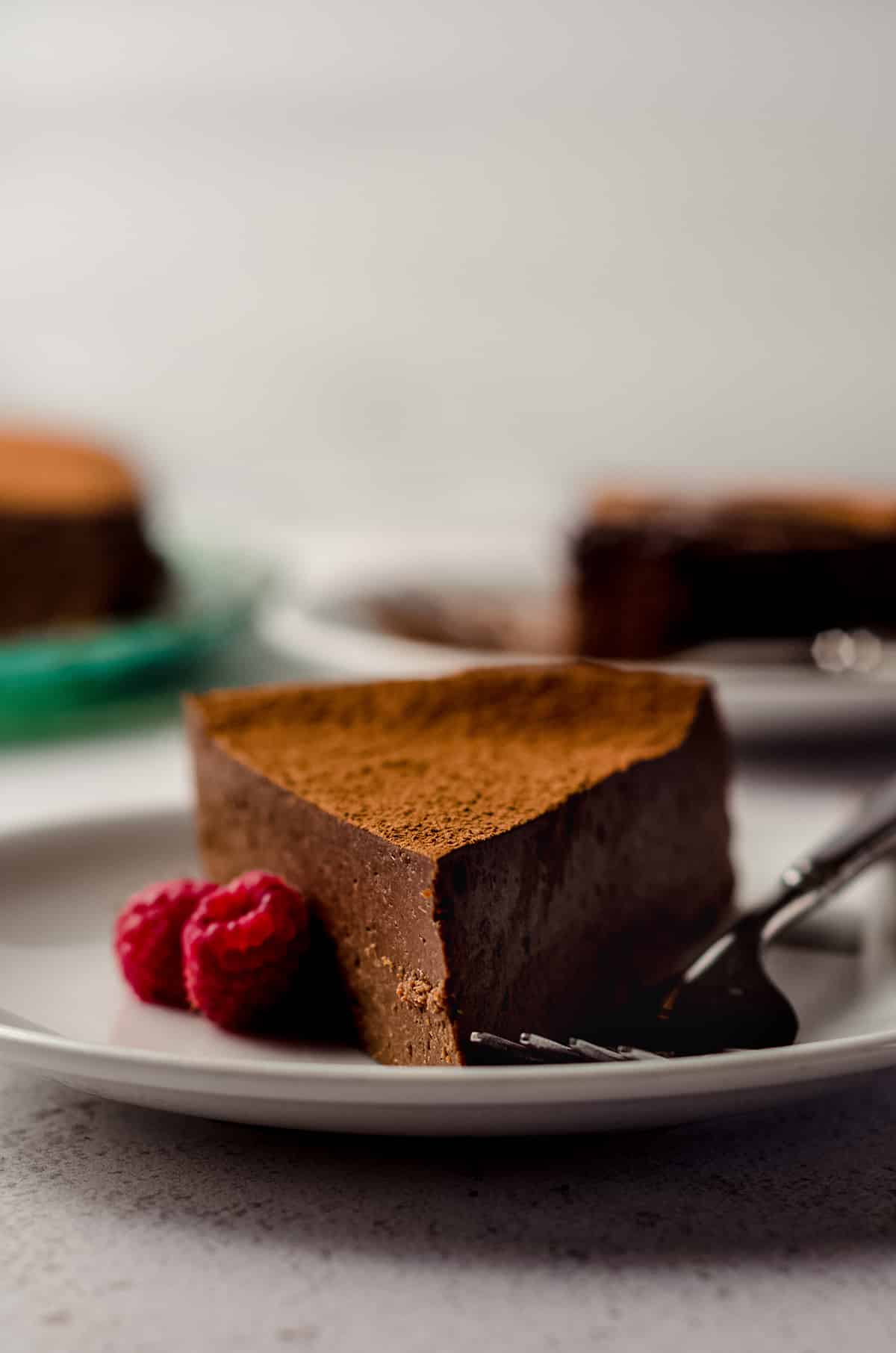 a slice of gluten free dairy free chocolate cake on a plate