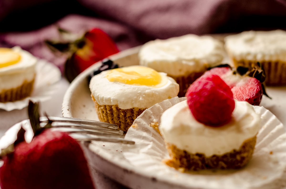 mini no bake cheesecakes on a plate with a fork