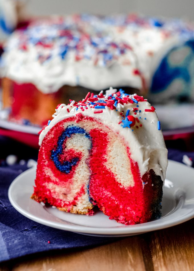 slice of red white and blue swirl cake on a plate