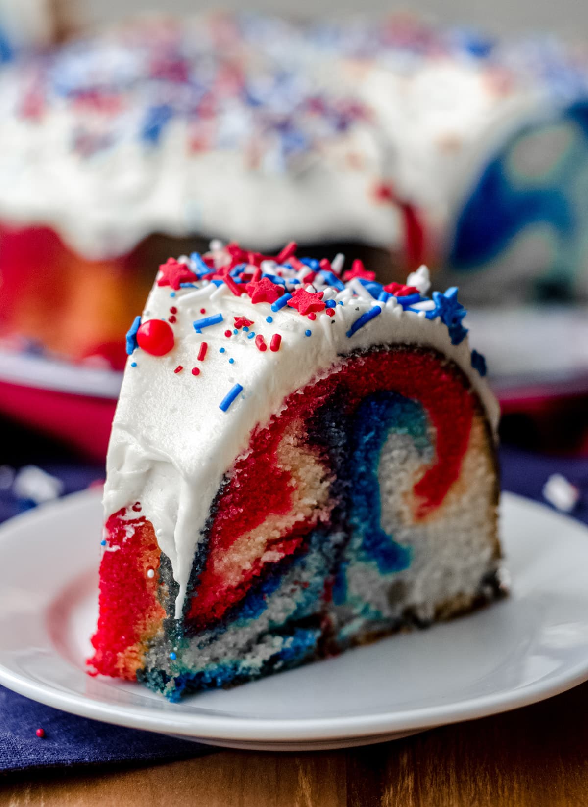 slice of red white and blue swirl cake on a plate