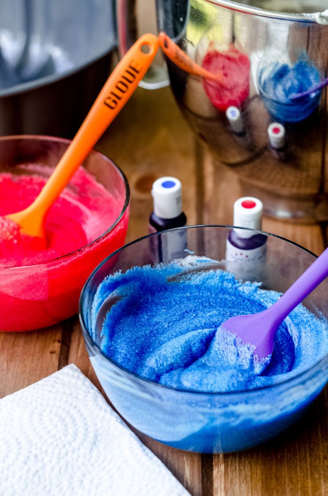 blue and red cake batter for a red white and blue swirl bundt cake