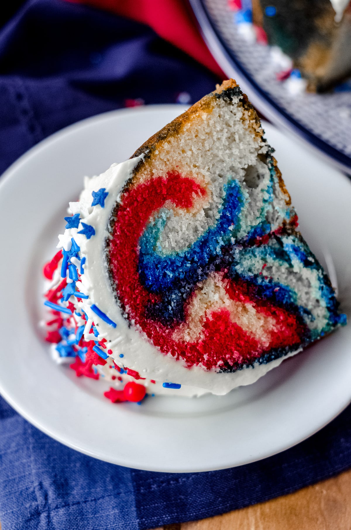 slice of red white and blue swirl cake on a plate