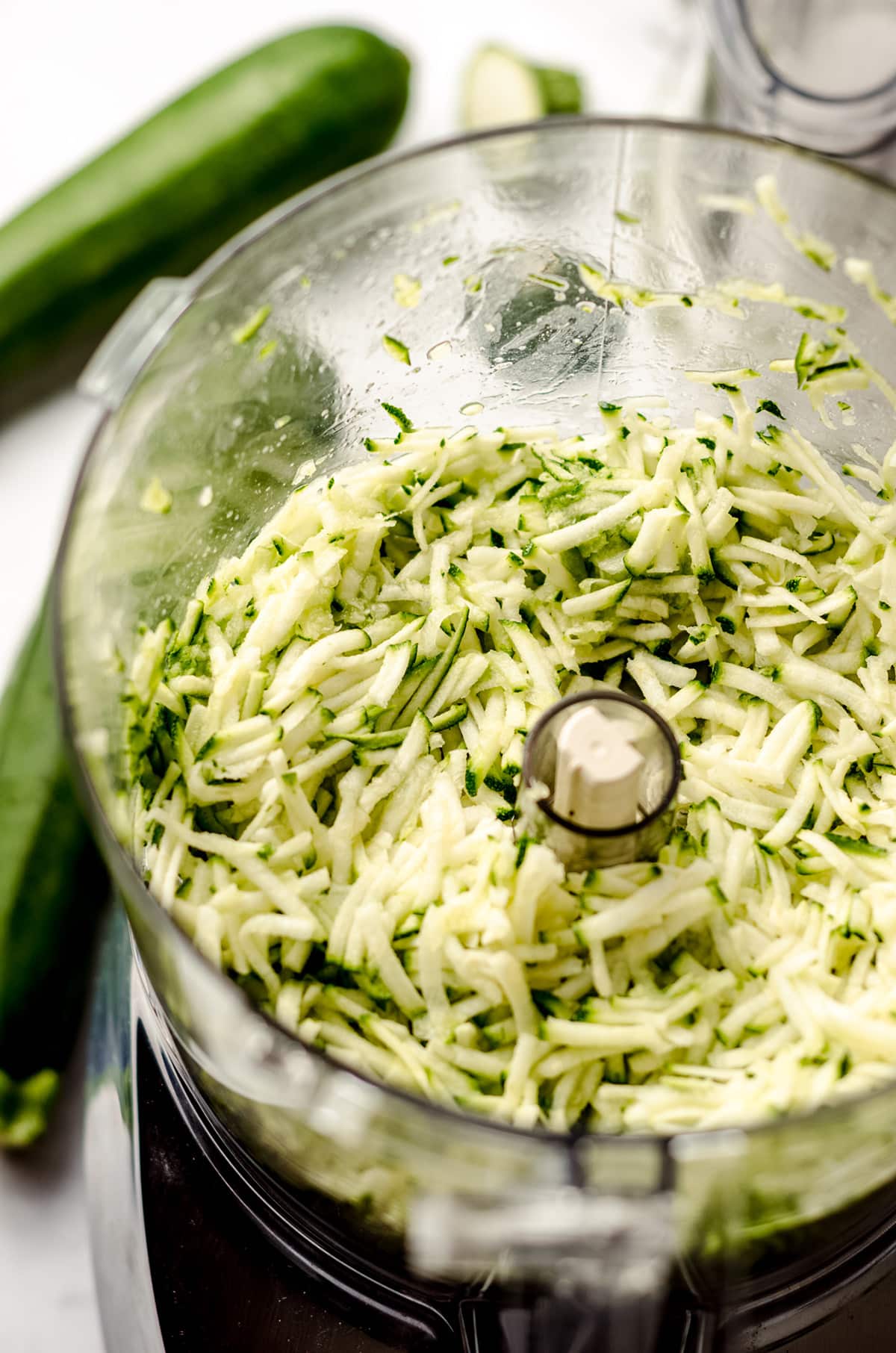 shredded zucchini in a food processor