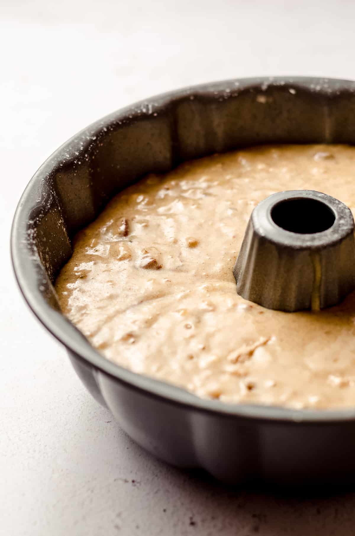 bananas foster cake batter in a bundt pan