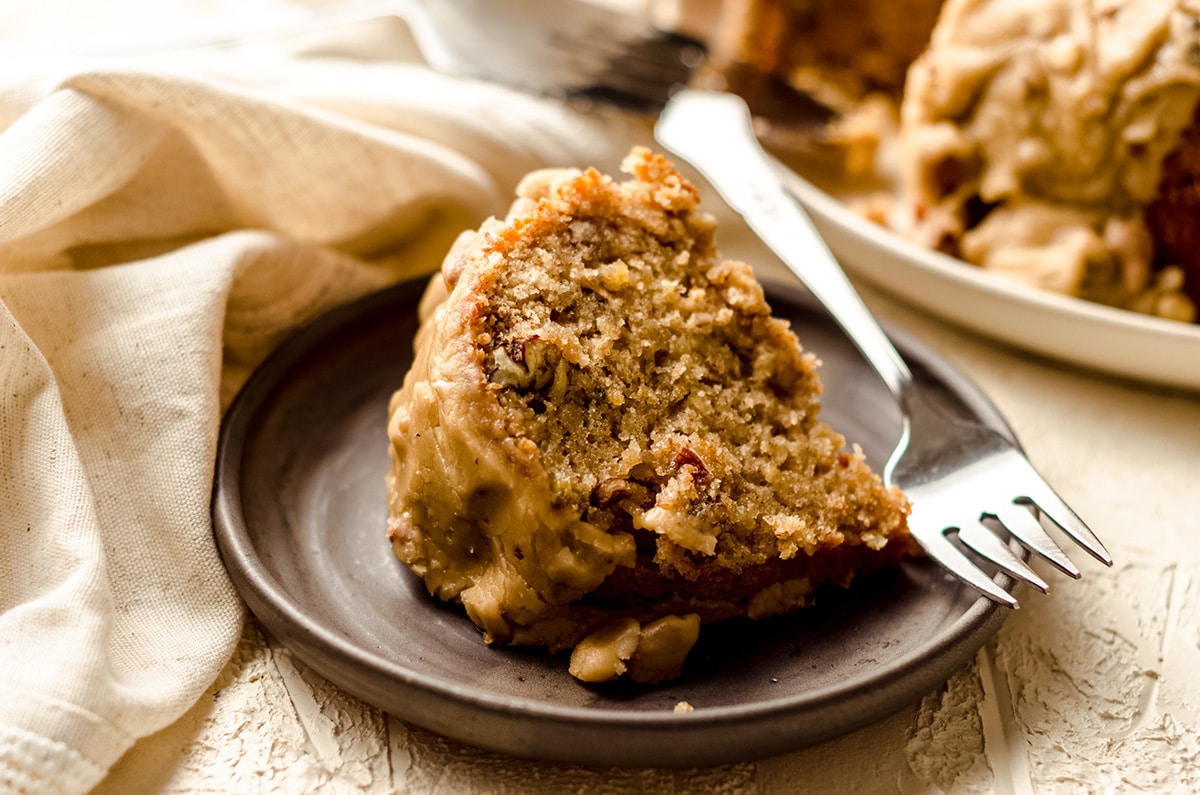 slice of bananas foster cake on a plate