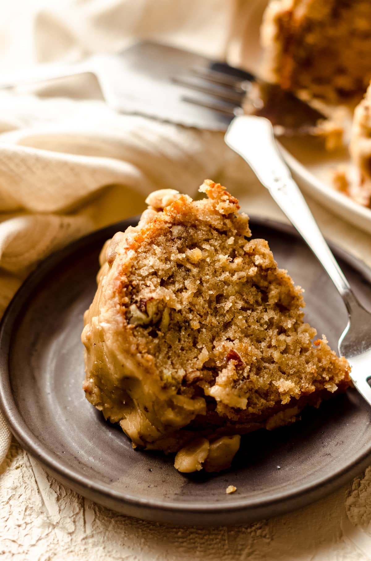 slice of bananas foster cake on a plate